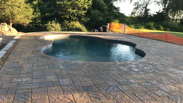 Paver pool deck at golden hour, Massachusetts
