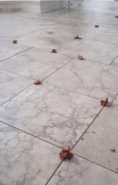 Tile floor installation in progress