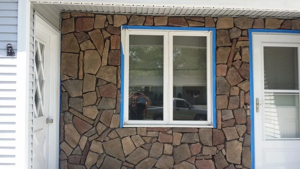 Fieldstone veneer around window and entry
