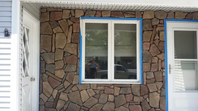 Fieldstone veneer around window and entry