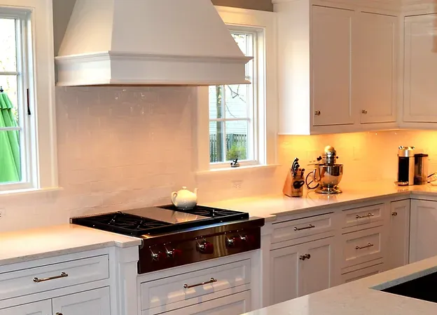Custom kitchen design with tailored cabinetry, an island, and coordinated finishes.