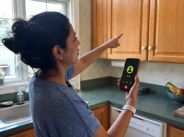 Owner walking a kitchen on a live video estimate call