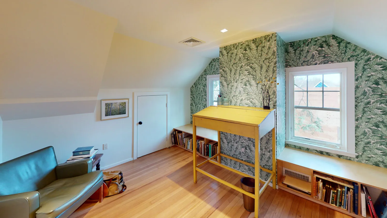 Attic study with built-in window-seat bookshelves