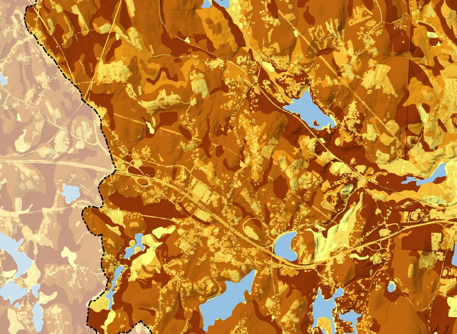A soil survey map showing shades of orange and brown indicating soil types across a landscape, with a dashed black line marking a property or county boundary and blue patches indicating water bodies.