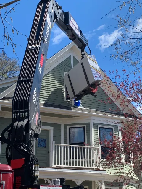 Boom truck delivering to a Victorian renovation