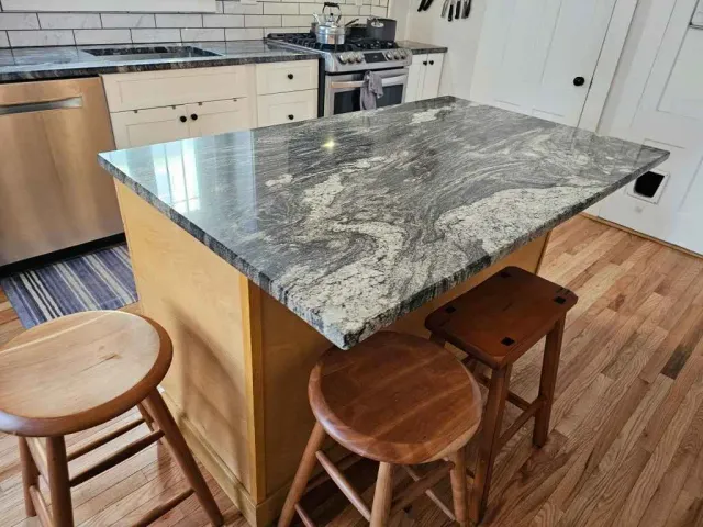 Custom granite island countertop with dramatic veining fabricated by Precision Granite Works in Concord, NH