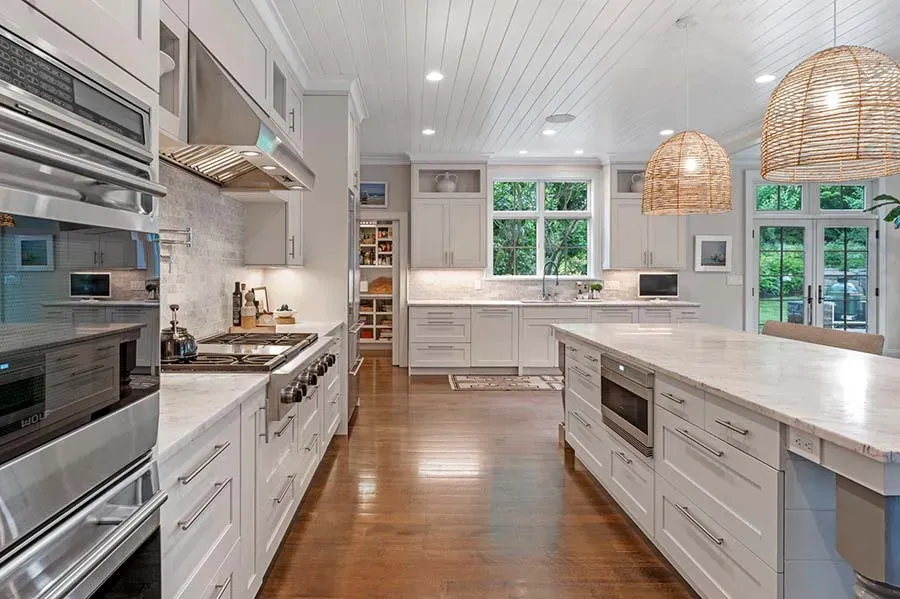 beautiful kitchen with hardwood floors and marble top counters