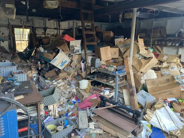 Garage packed floor to ceiling with accumulated items