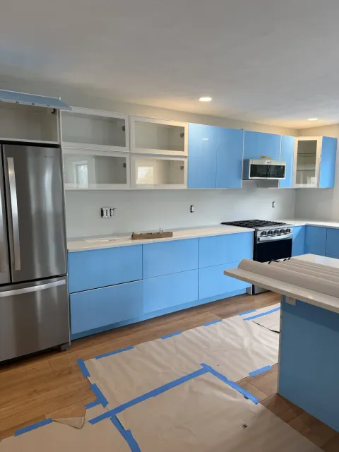Salem kitchen with stainless appliances white cabinetry island and counters