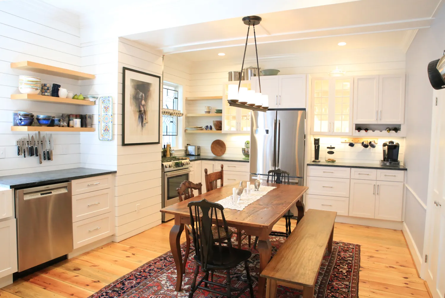 Welcoming kitchen space with shiplap walls and open shelving