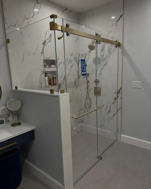 Kev and Corey just finished up this install today using @crlaurence satin brass hardware, lowiron glass from @qualityenclosuresinc and @diamonfusionintl protective coating to keep it looking this good for a long time.