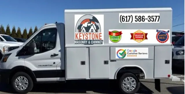 A white van with the word keystone on the side is parked in a parking lot.
