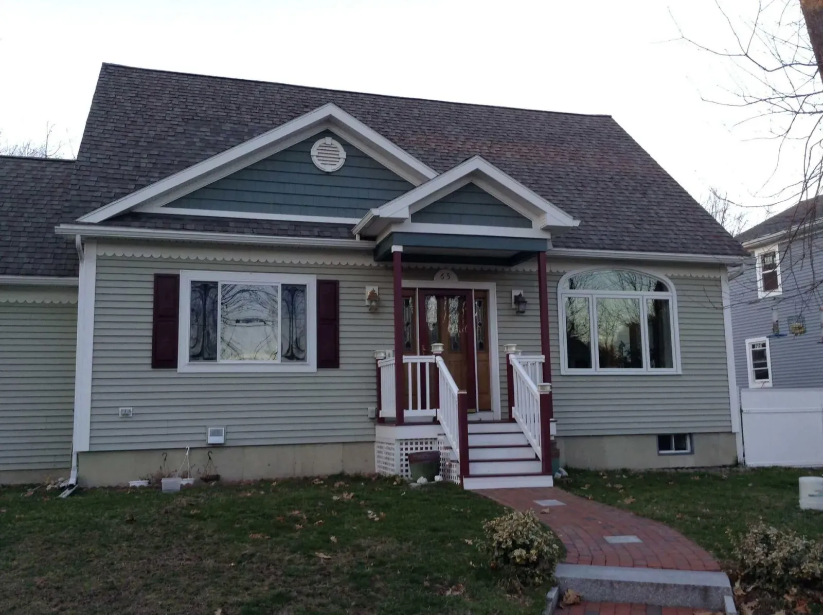 The front of a house with a porch and stairs