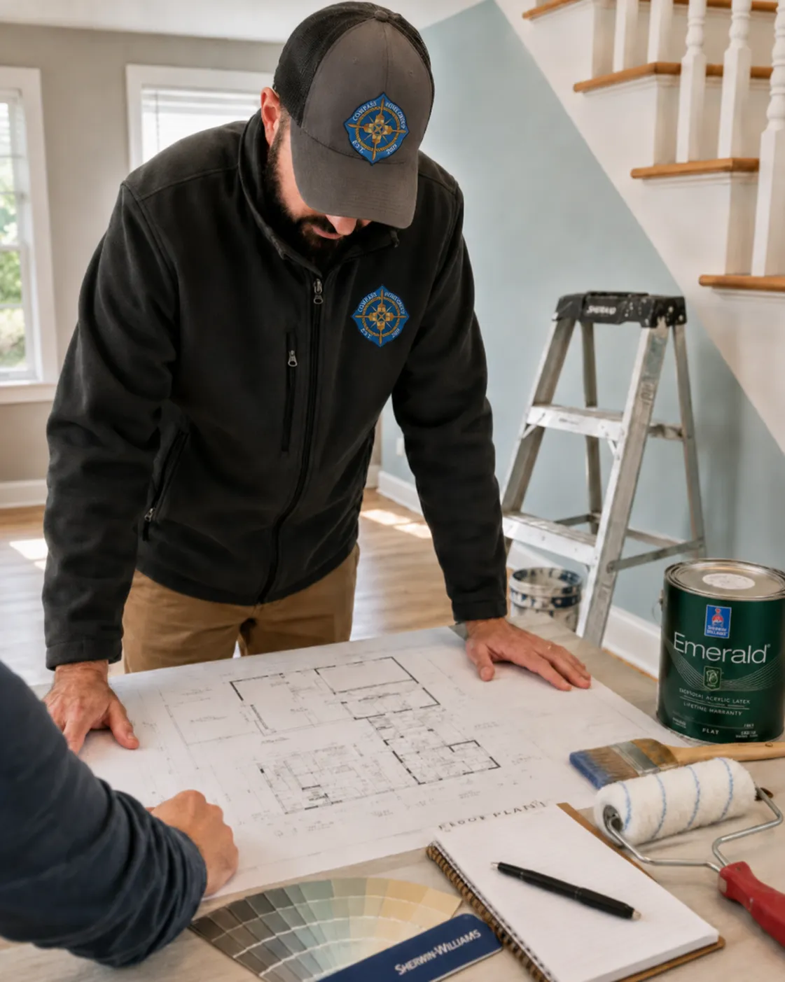 Contractor reviewing home remodeling plans in Cape Cod