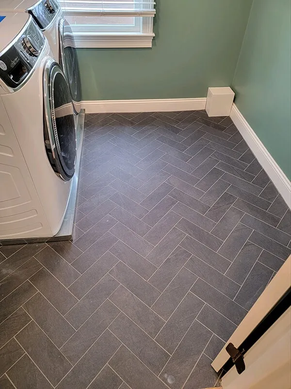 Dark gray tiles in laundry room in Ashland, MA