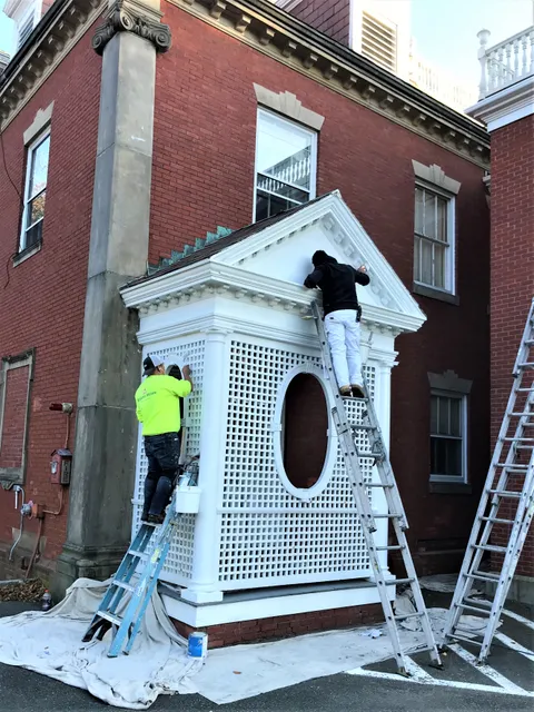 Crew repainting a restored cupola