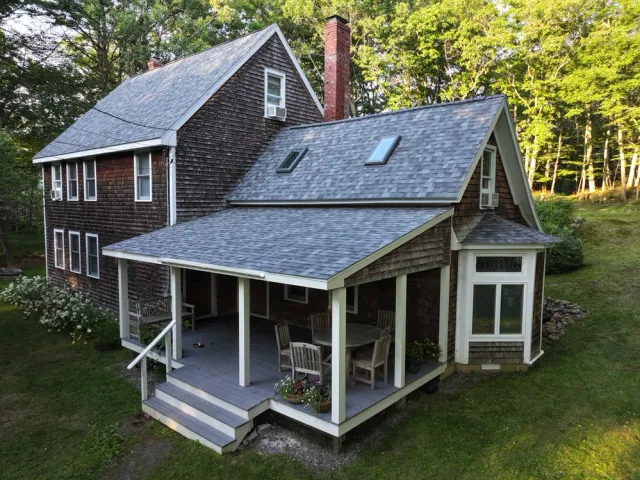 House with covered porch and outdoor dining