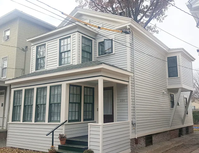 Greek revival, 1930's additions, Anderson replacement windows.