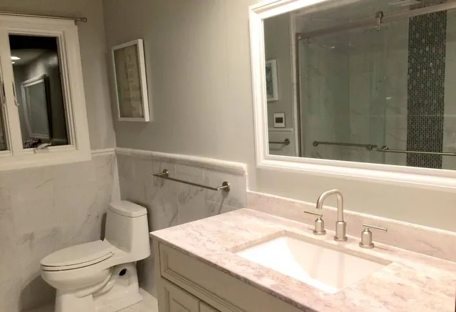 Bathroom with marble-top vanity