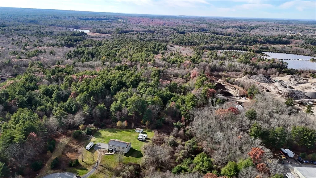 The land for sale consists of 4 lots, property has not had a perc test.  There is an old subdivision plan which is not valid. There  is a railroad crossing to access the 35.04 acre lot built by MBTA which is locked but is accessible.