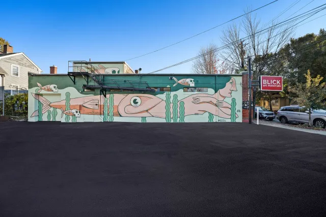 a storefront with a new paved driveway