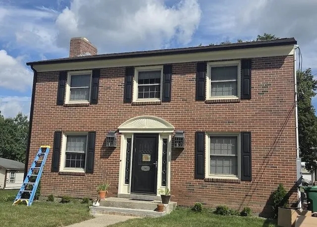black seamless gutters installed in Clinton MA by Gutter Man Mike