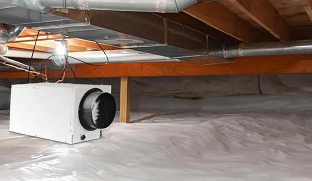 Dehumidification system installed in crawl-space