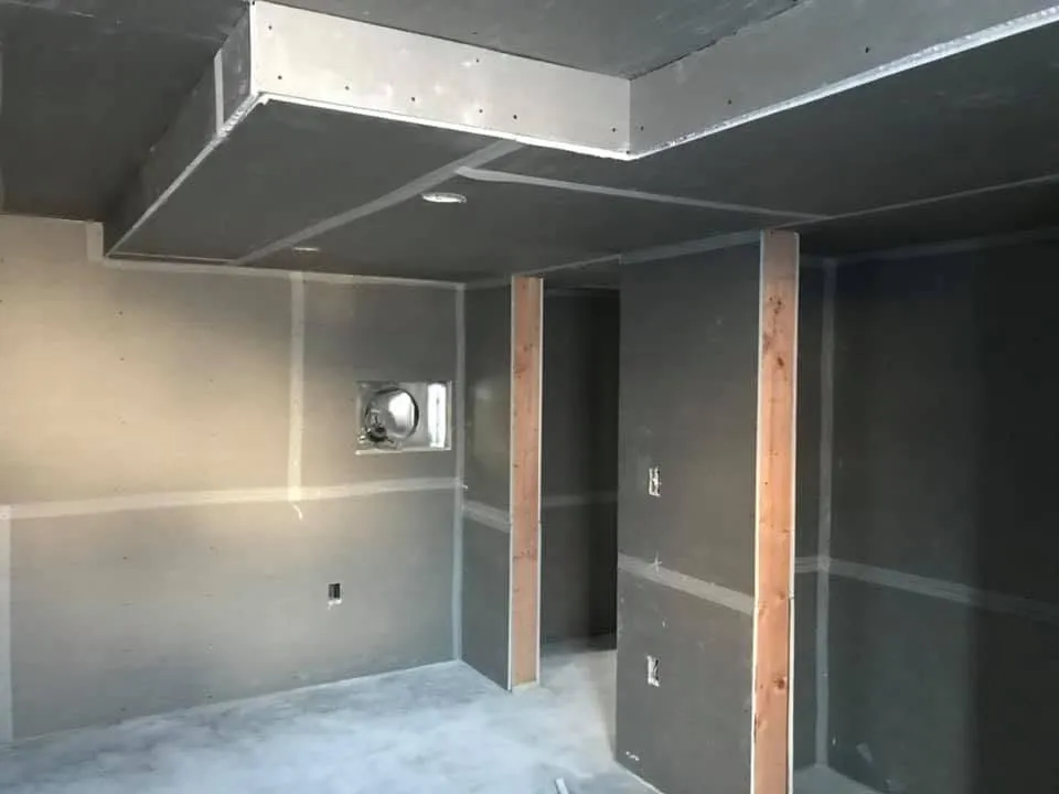 Basement framing with plumbing and HVAC rough-in