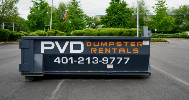 Empty 10 yard roll-off dumpster, side view