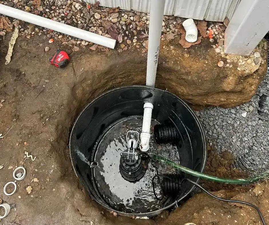 White drainage pipes connected Sump Pump Installation Boston, MA