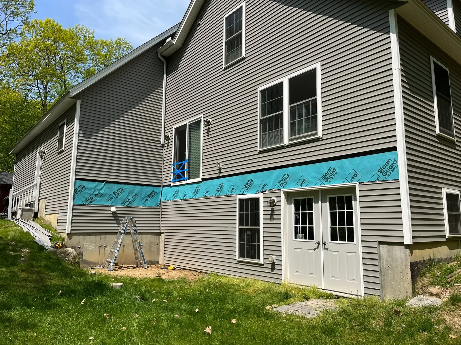 Why ledger board protection matters more than you think 🧠🔨

One of the most critical — and most overlooked — parts of a deck isn’t what you see… it’s what’s between the deck and the house.

When installing a ledger board, a full layer of protection (proper flashing + waterproof membrane) is essential. Without it, moisture can get trapped between the deck and your home, leading to rot, mold, and serious structural issues over time.

Here’s why we never skip this step:
• Prevents water intrusion
• Protects your home’s framing and sheathing
• Extends the life of the deck AND the house
• Meets modern building code requirements

Skipping proper ledger protection might save time up front — but it almost always costs more later.

This is one of those details you’ll never see once the deck is built…
but you’ll absolutely feel it if it’s done wrong.

Built right. Built to last.

#WisdomWednesday #DeckBuilding #NHContractor
#BuiltRight #DeckDetails #ConstructionMatters
#NewHampshireHomes #QualityConstruction