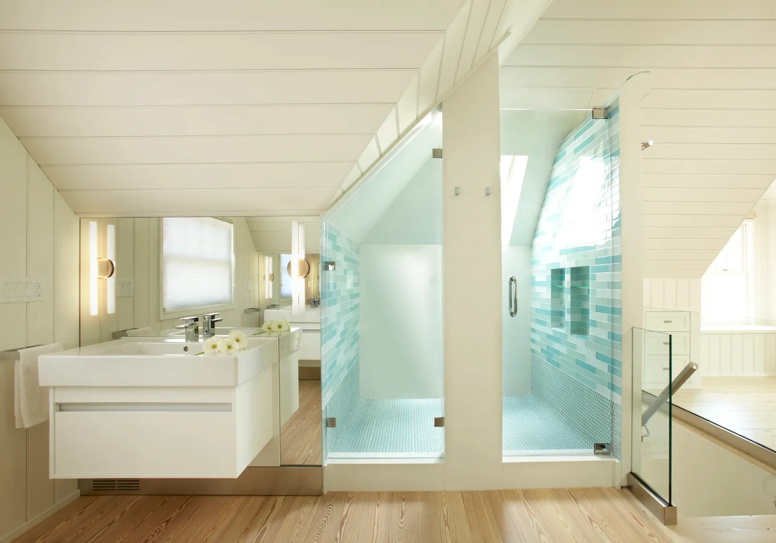 Renovated bath with glass shower enclosure under a shiplap ceiling