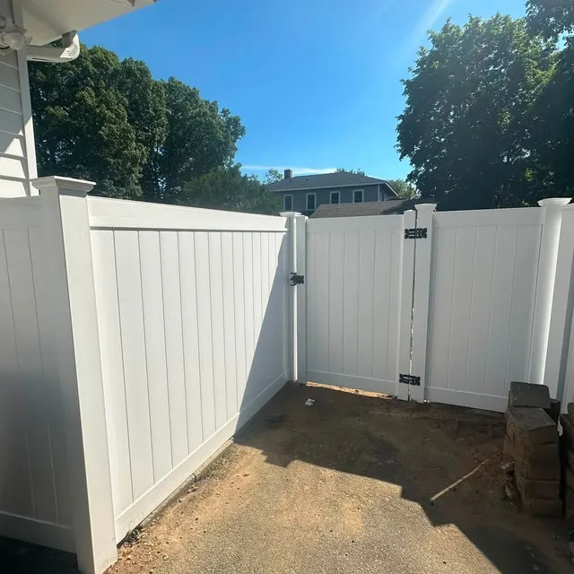 White vinyl privacy fence with double gate