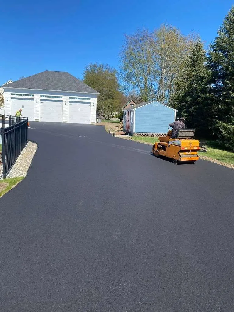 Newly paved driveway with a utility vehicle