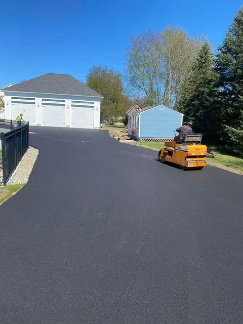 Newly paved driveway with a utility vehicle