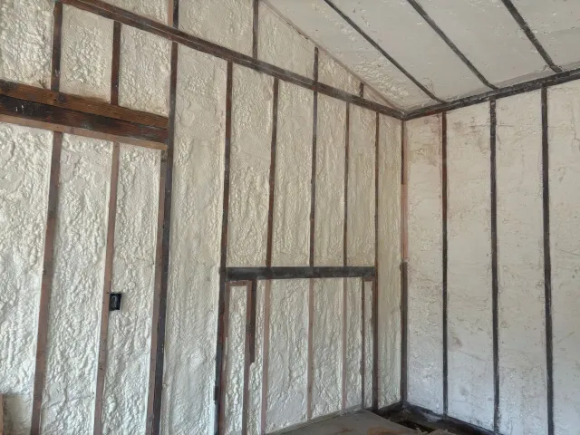 A room with foam insulation on the walls and ceiling.