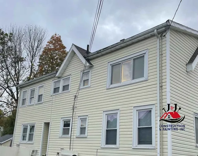 Exterior siding and trim after replacement