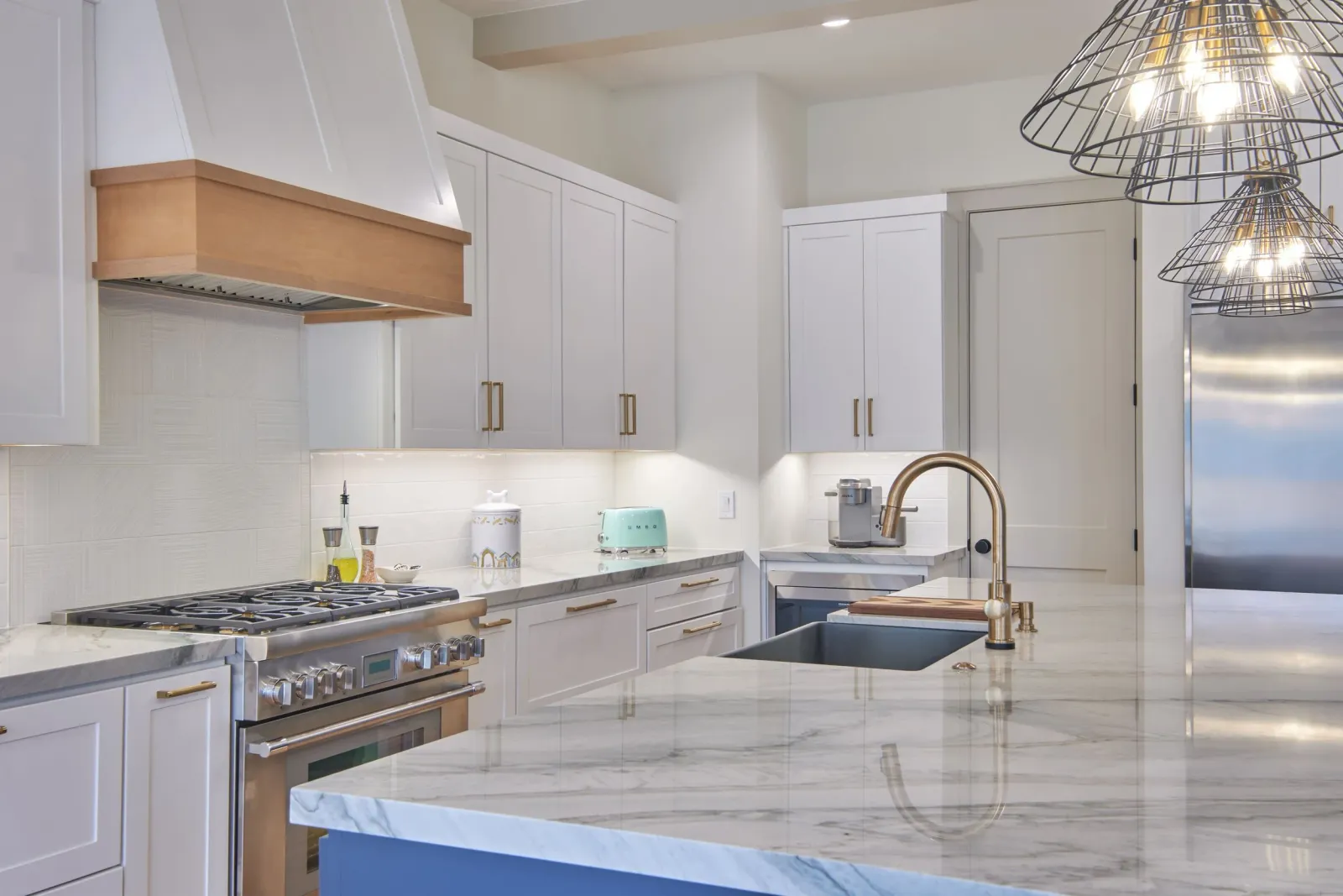 Modern White Kitchen with Brushed Gold Hardware and Quartz Countertop.jpeg
