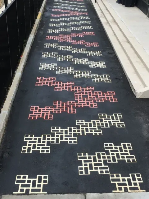 A row of letters on a black surface that says ' a ' on it