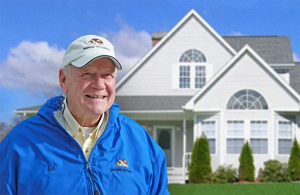 Photo of Ed Moore Founder of Moore Security and Services outside a Cape Cod Home