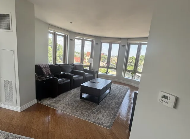Bright condo living room with city views, professionally cleaned by Allegry Cleaning Services