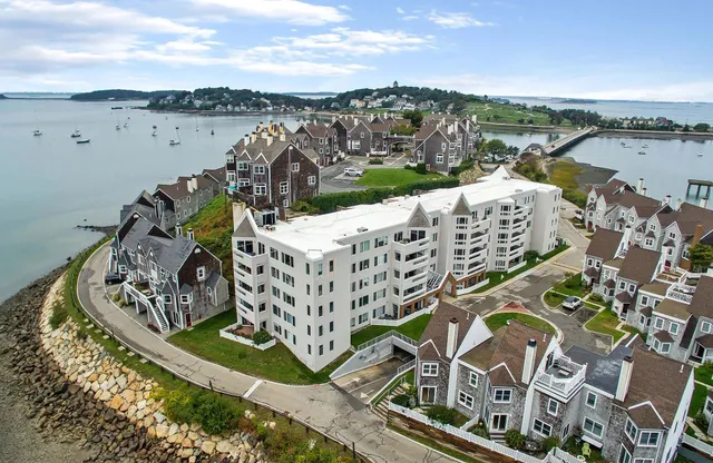 Aerial view of a completed waterfront condominium roofing project