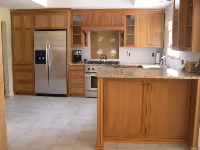 Cherry kitchen with tall peninsula