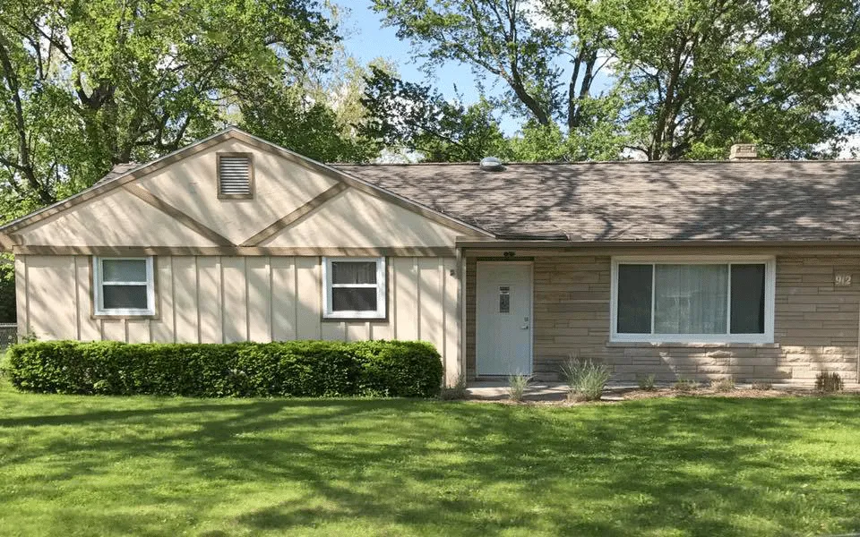 Double hung windows on the left and a 3-lite sliding window on the right.