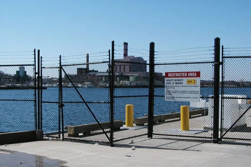 Waterfront security fencing at an industrial site