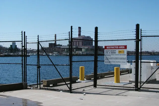 Waterfront security fencing at an industrial site