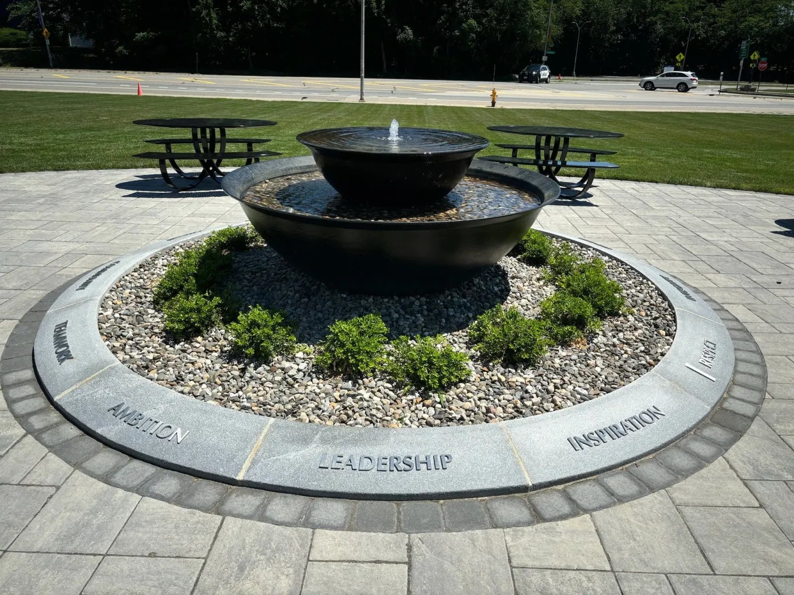 Custom-built stone fountain installed by masonry contractors in Worcester, MA — handcrafted landscape water feature designed to enhance outdoor space with natural stonework.