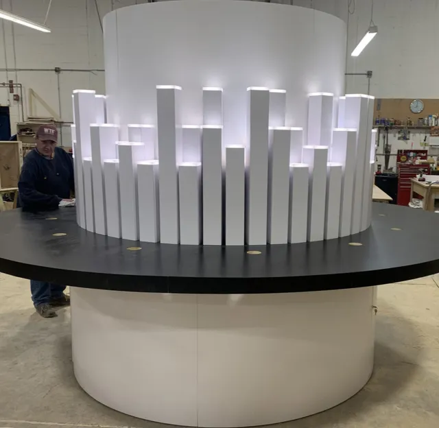 White circular display with glowing vertical columns
