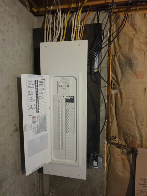 Completed Leviton electrical panel with generator interlock installed in Bowdoin, Maine