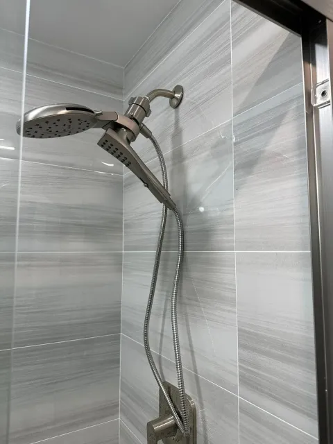a close up of a shower head in a bathroom .